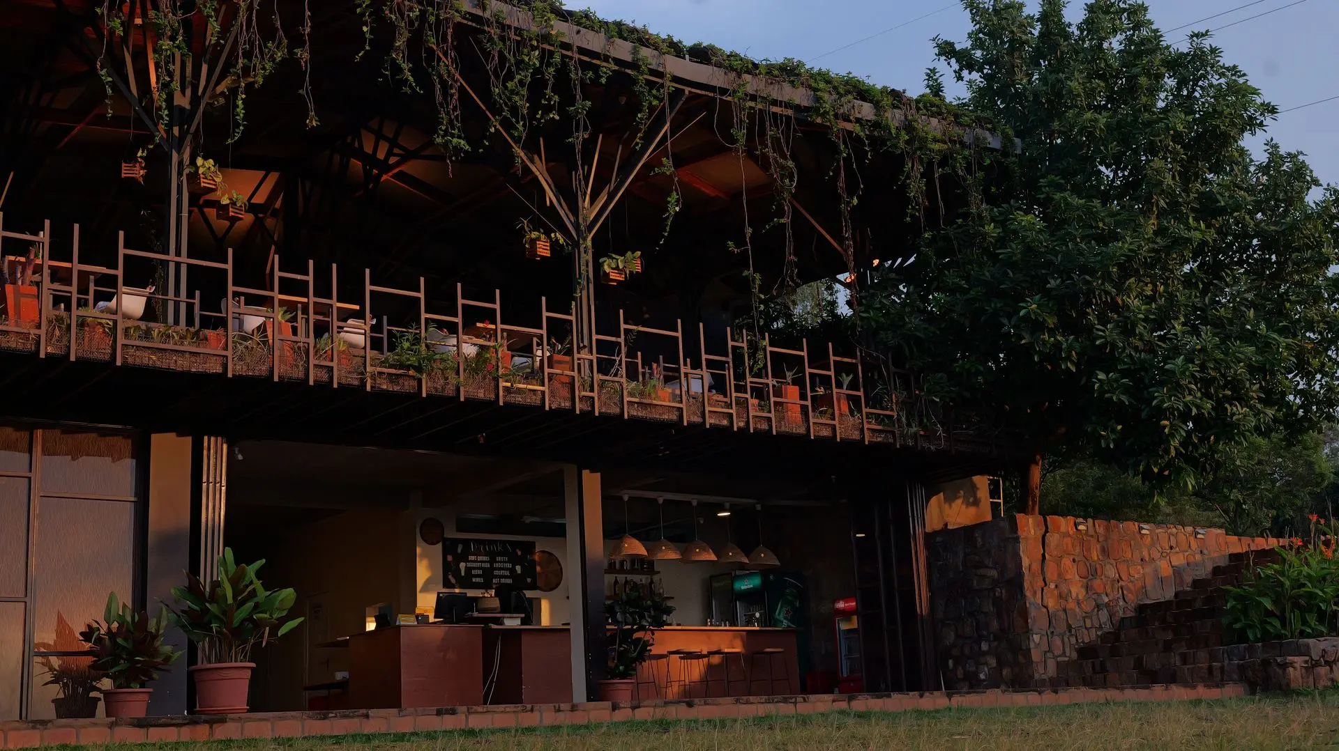 The Fazenda Sengha restaurant deck, wrapped in hanging vines, overlooking the grounds.